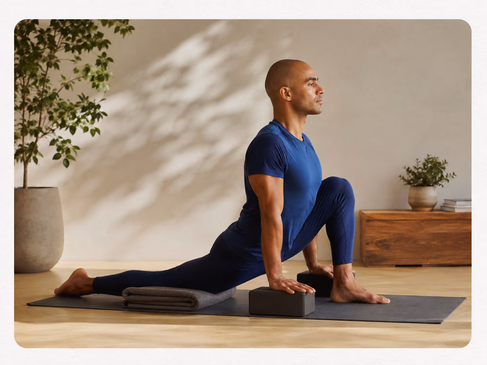 Gentle low-lunge hip mobility yoga pose with beginner-friendly blocks and blanket support
